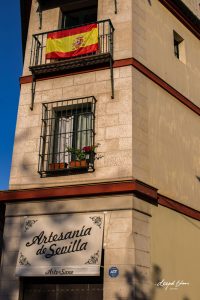 Spain-flag-hanging-window-Seville