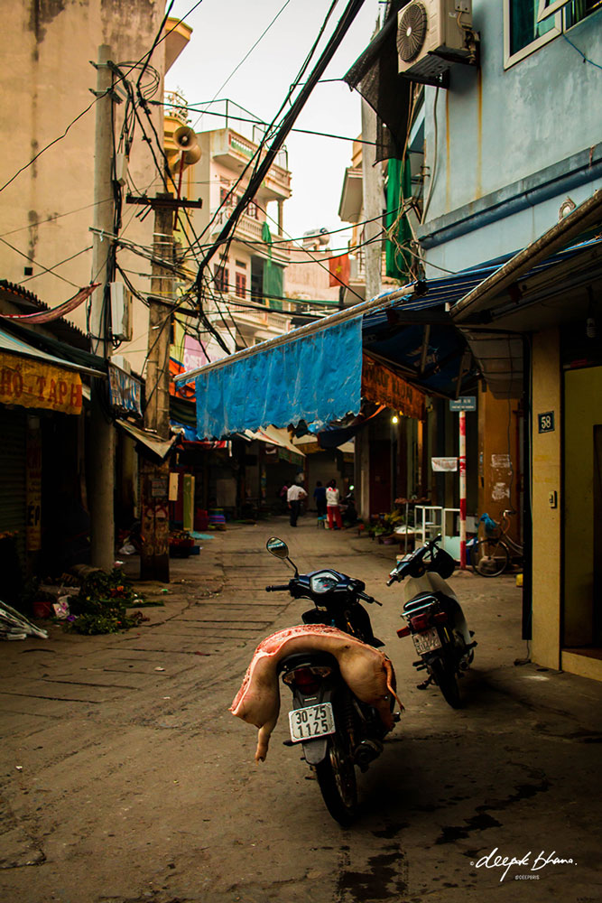 Breakfast traders in the side streets of Hanoi, Vietnam. todayfarer