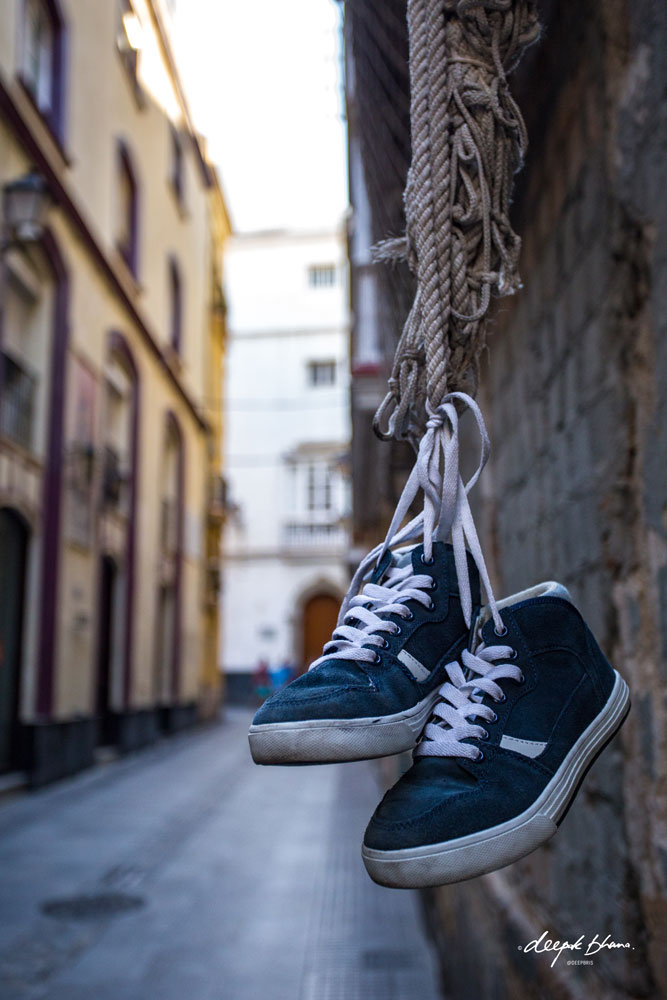 Cadiz-Spain-street-shoes-hanging